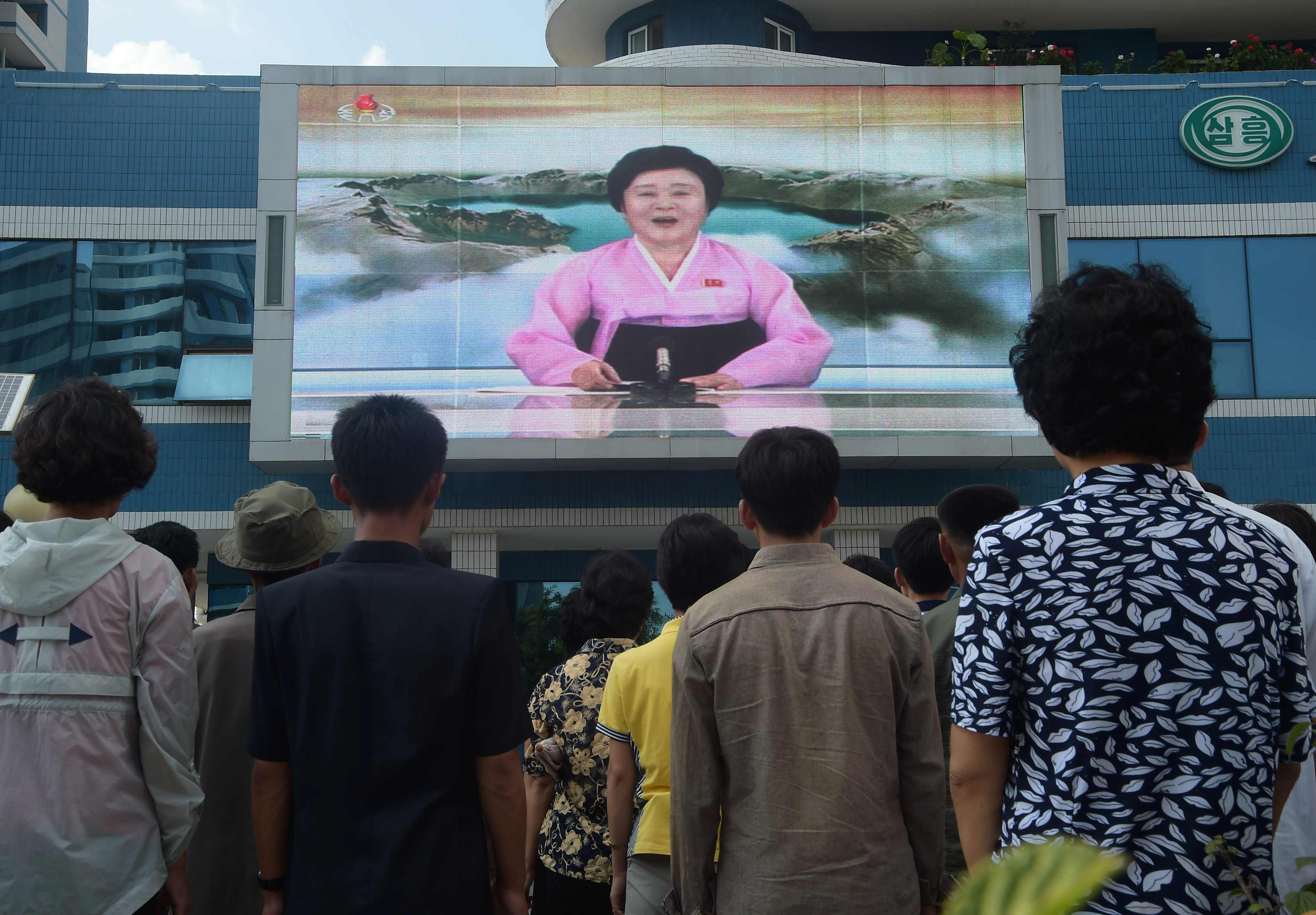 Pyongyang residents watch news of their country’s sixth nuclear test on September 3, from a video screen installed on Mirae Scientists Street in Pyongyang. There are more than a few people, including in South Korea, who may loathe the Kim family regime but admire Pyongyang’s refusal to give in to US pressure to abandon its missile and nuclear programme. Photo: AFP