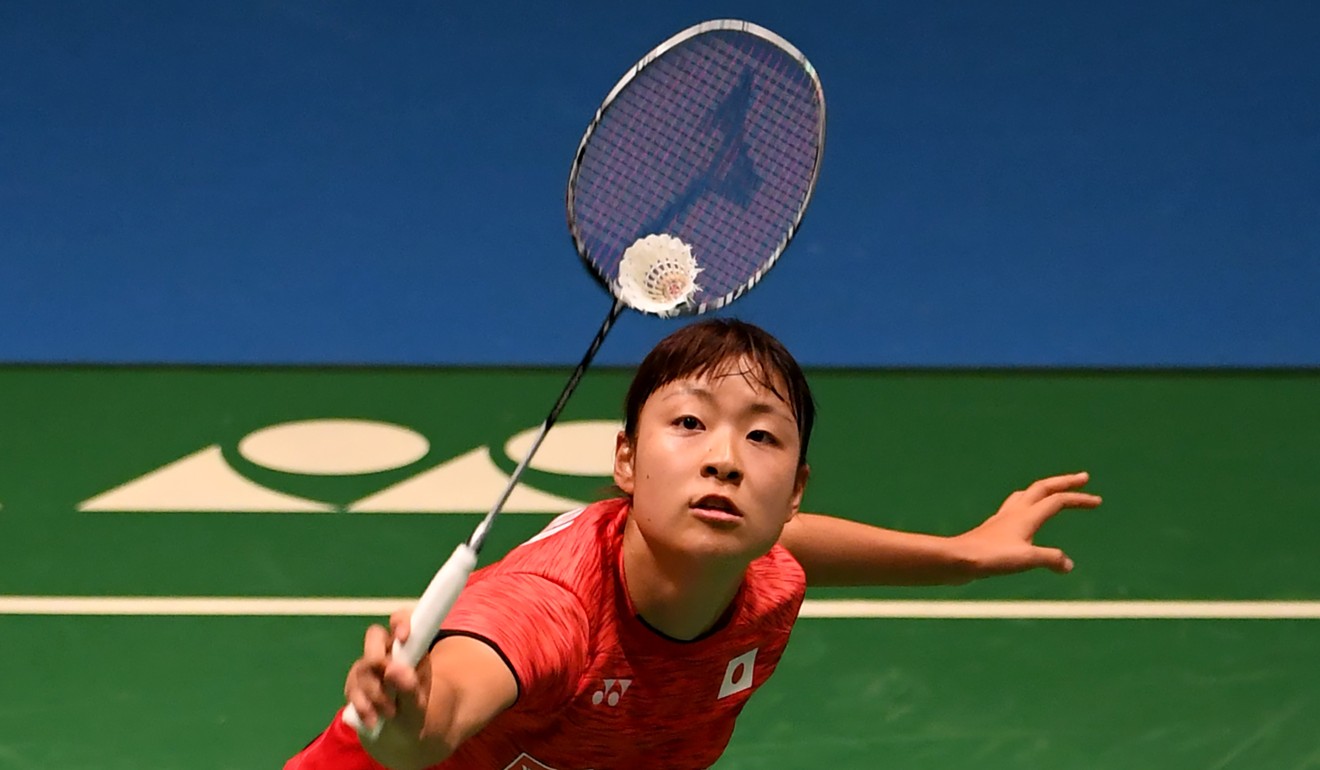 Japan’s Nozomi Okuhara hits a return against Zhang Beiwen, of the US, during their quarter-final. Photo: AFP