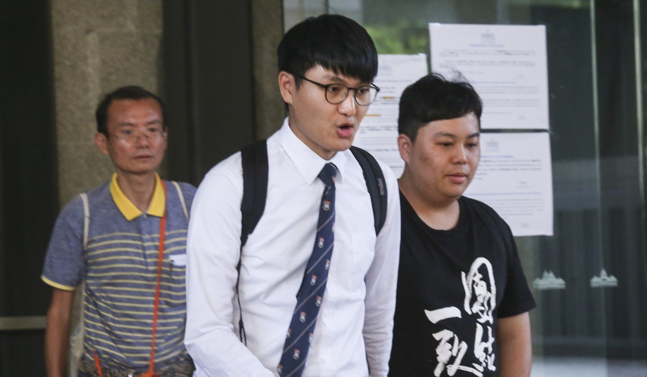 Billy Fung Jing-en (middle) and Colman Li Fung-kei (right) leave the West Kowloon Court in July. The pair were spared a jail time on Thursday. Photo: K.Y. Cheng