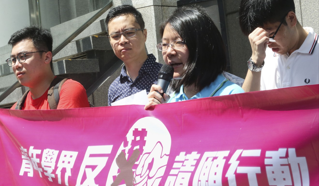 The president of Hong Kong Youth Enlightenment, Ashley Tse, urges the secretary for justice and police to act against pro-Hong Kong independence movements, outside police headquarters in Wan Chai. Photo: David Wong