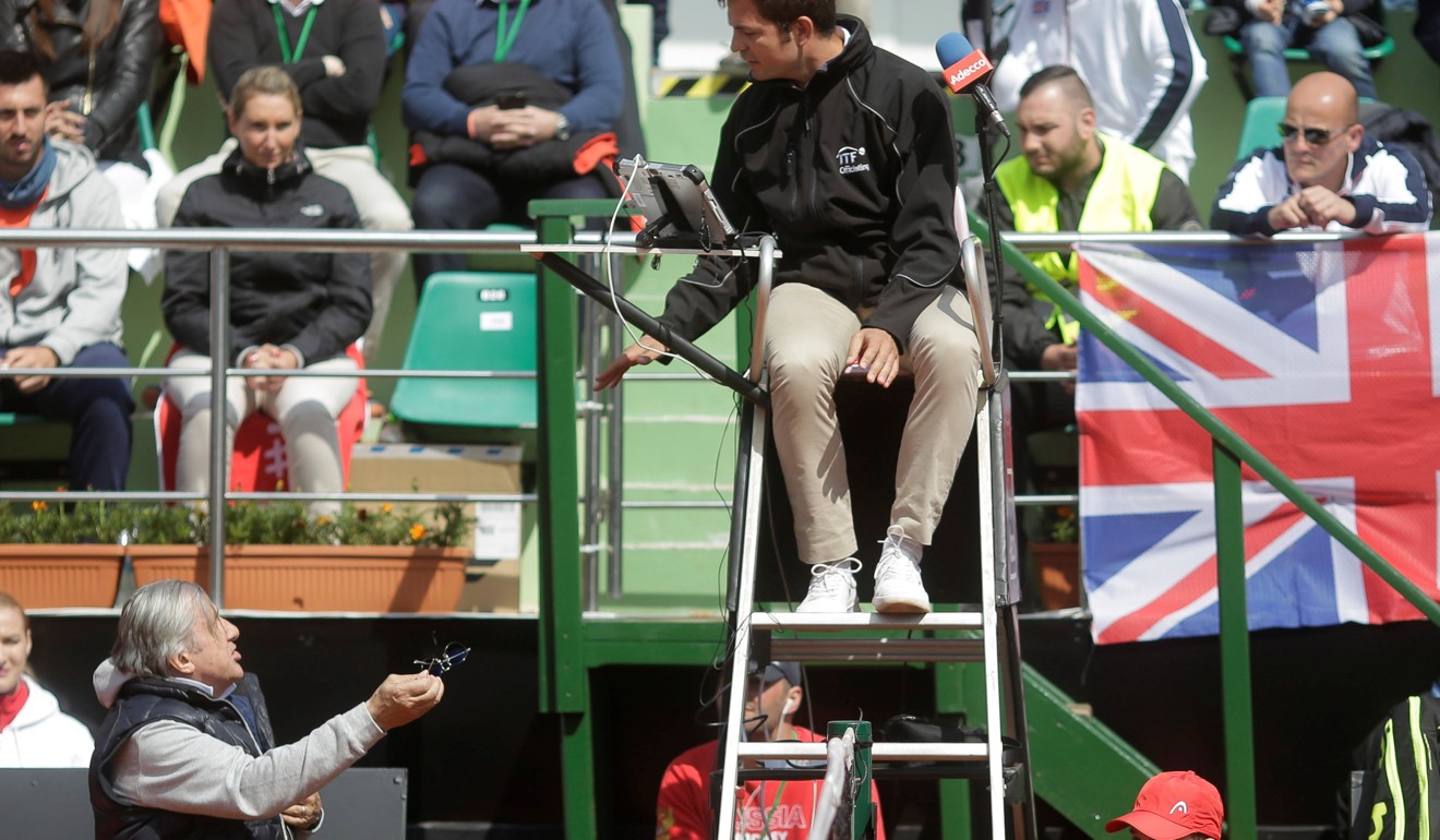 Ilie Nastase argues with the chair umpire during the Fed Cup match against Great Britain in April that led to his two-year ban. Photo: Reuters