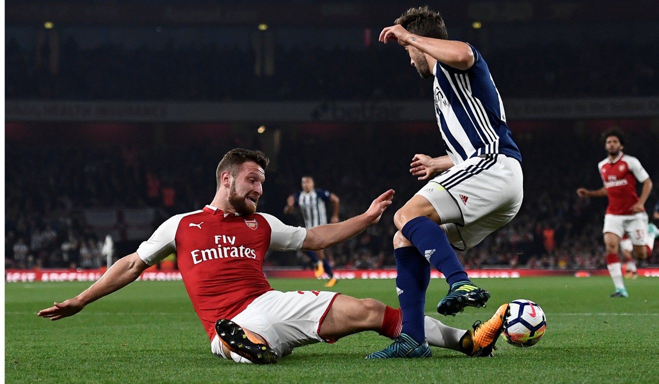 West Bromwich Albion's Jay Rodriguez goes down under a challenge from Arsenal's Shkodran Mustafi leading to appeals for a penalty. Photo: Reuters