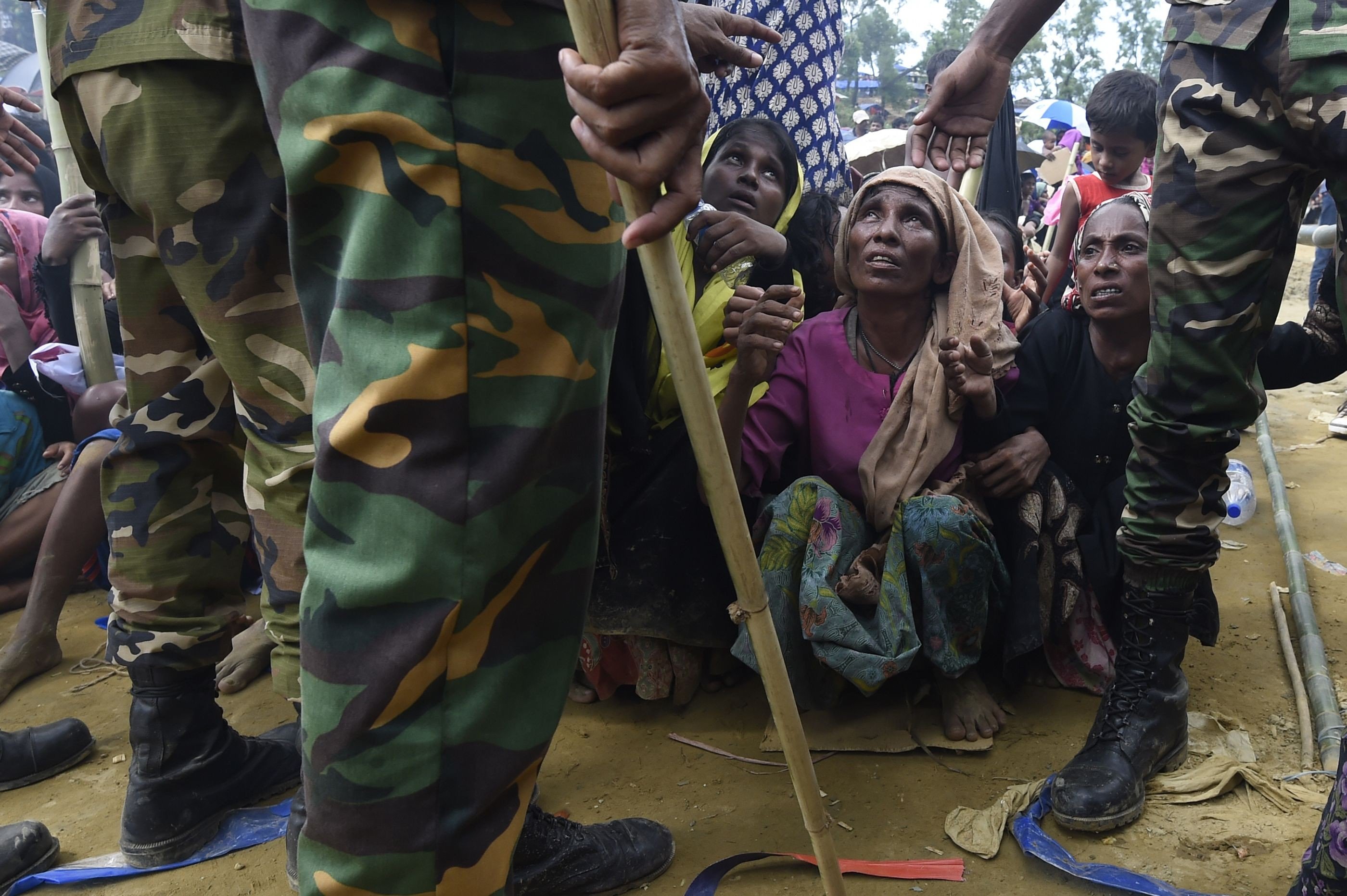 Rohingya refugees wait for food to be distributed by the Bangladesh army at the Balukhali refugee camp in Cox’s Bazar. With Bangladesh already hosting tens of thousands of Rohingya who have fled Myanmar over the years, this latest wave poses significant risks not only to Bangladesh, but to the region as a whole. Photo: AFP