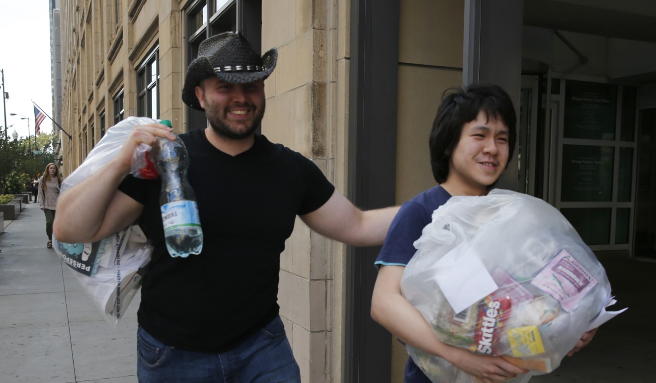 Amos Yee (right) leaves the US immigration field office with his friend Adam Lowisz on Tuesday in Chicago. YPhoto: AP