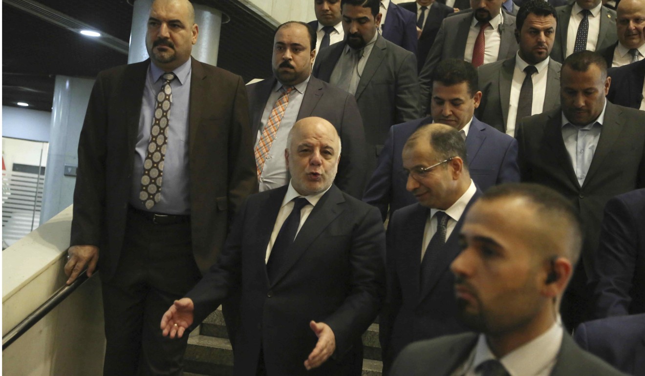 Iraqi Prime Minister Haidar al-Abadi arrives at parliament in Baghdad. Photo: AP