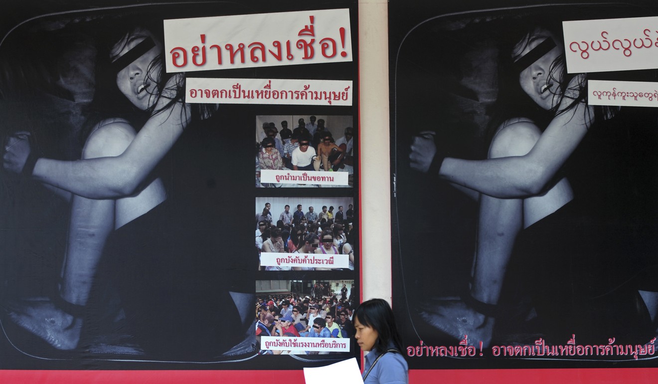Human trafficking in the spotlight in a campaign poster at the Immigration Bureau in Bangkok, Thailand. Photo: AFP