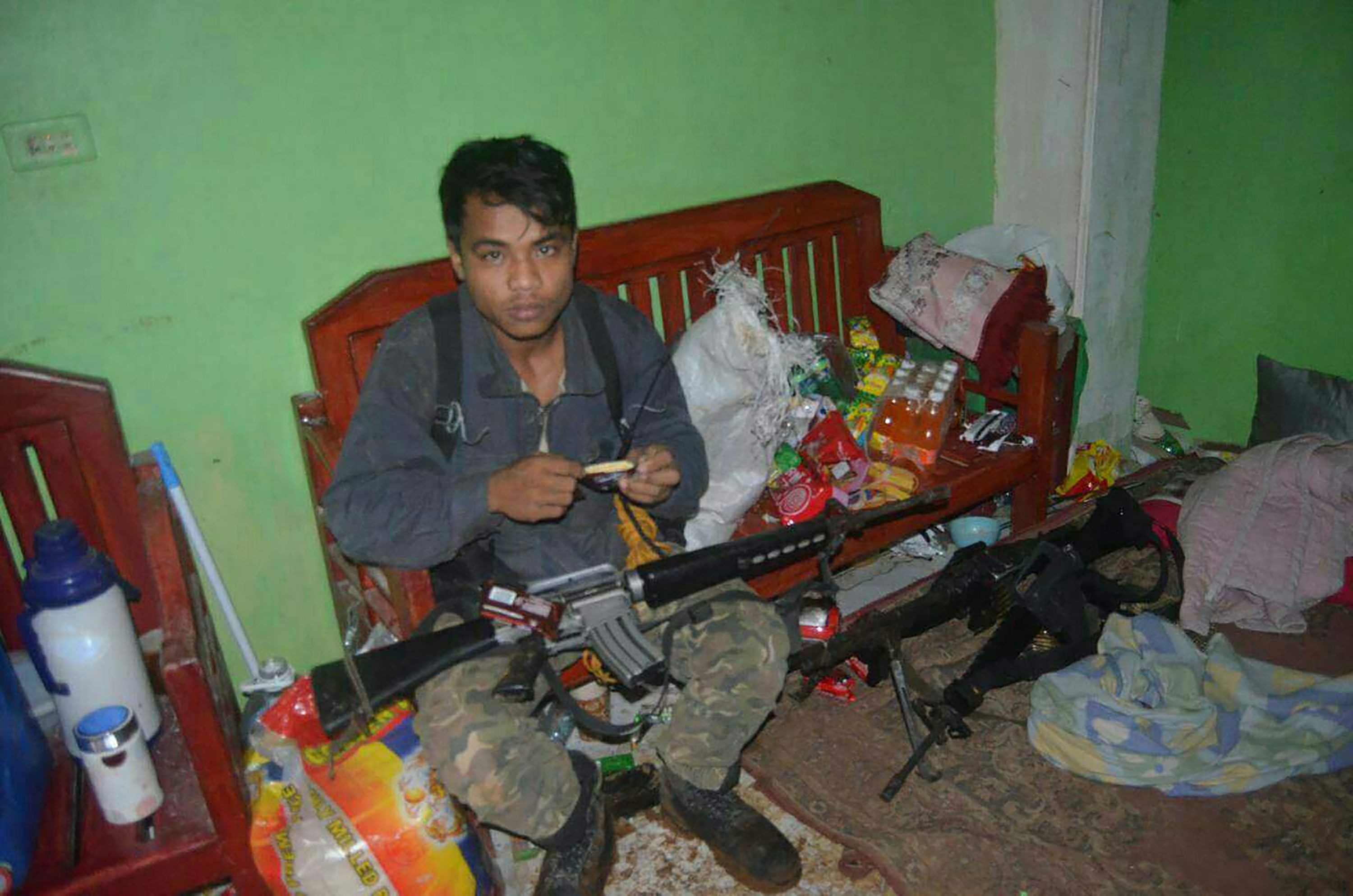 A member of the militant Maute group is seen inside a house in Marawi in July, two months after the Islamic State-affiliated group seized the city. Photo: AFP