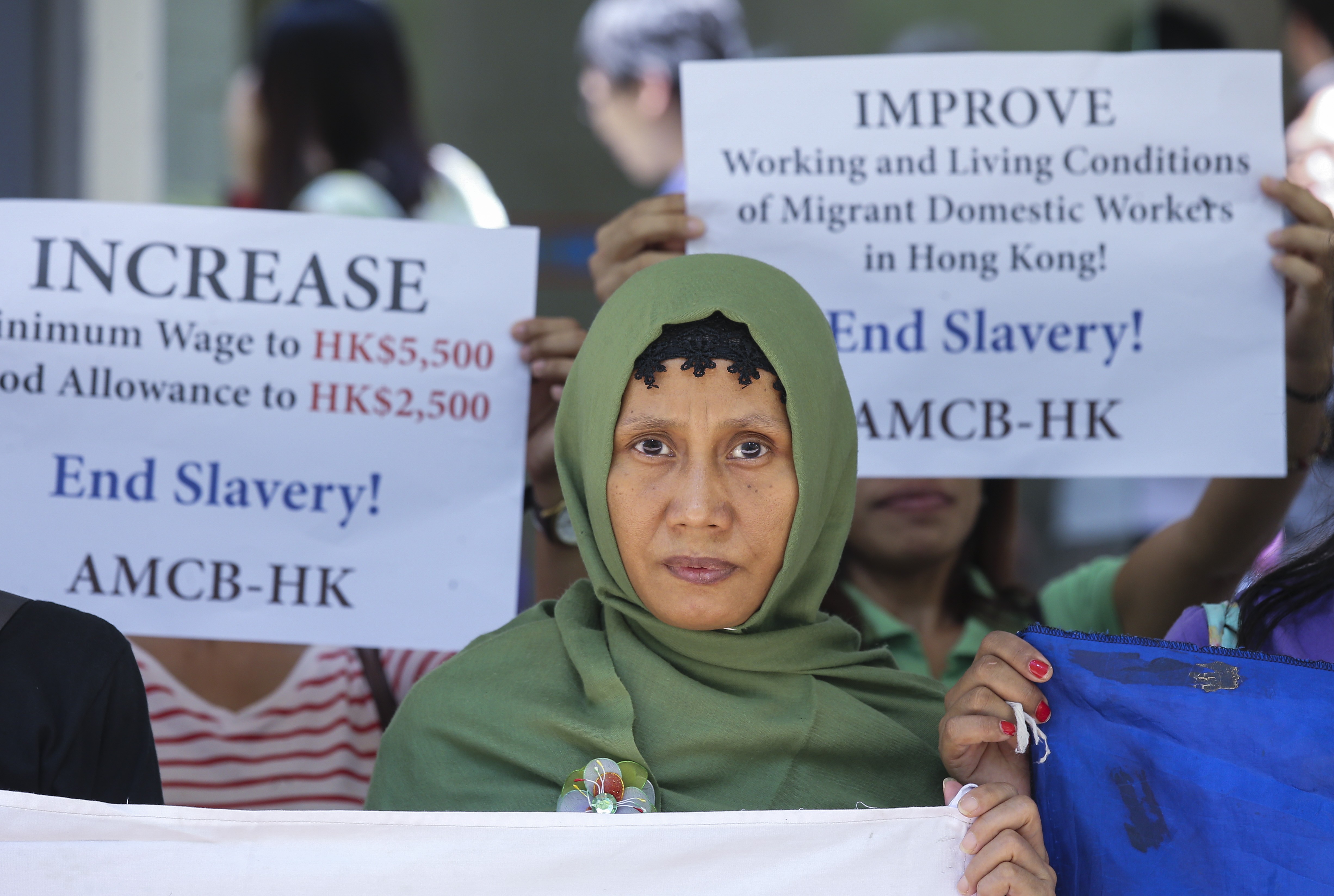 Foreign domestic helpers in Hong Kong stage a rally asking for a pay rise and to meet Labour Department officials, at the Harbour building in Central. Photo: Dickson Lee