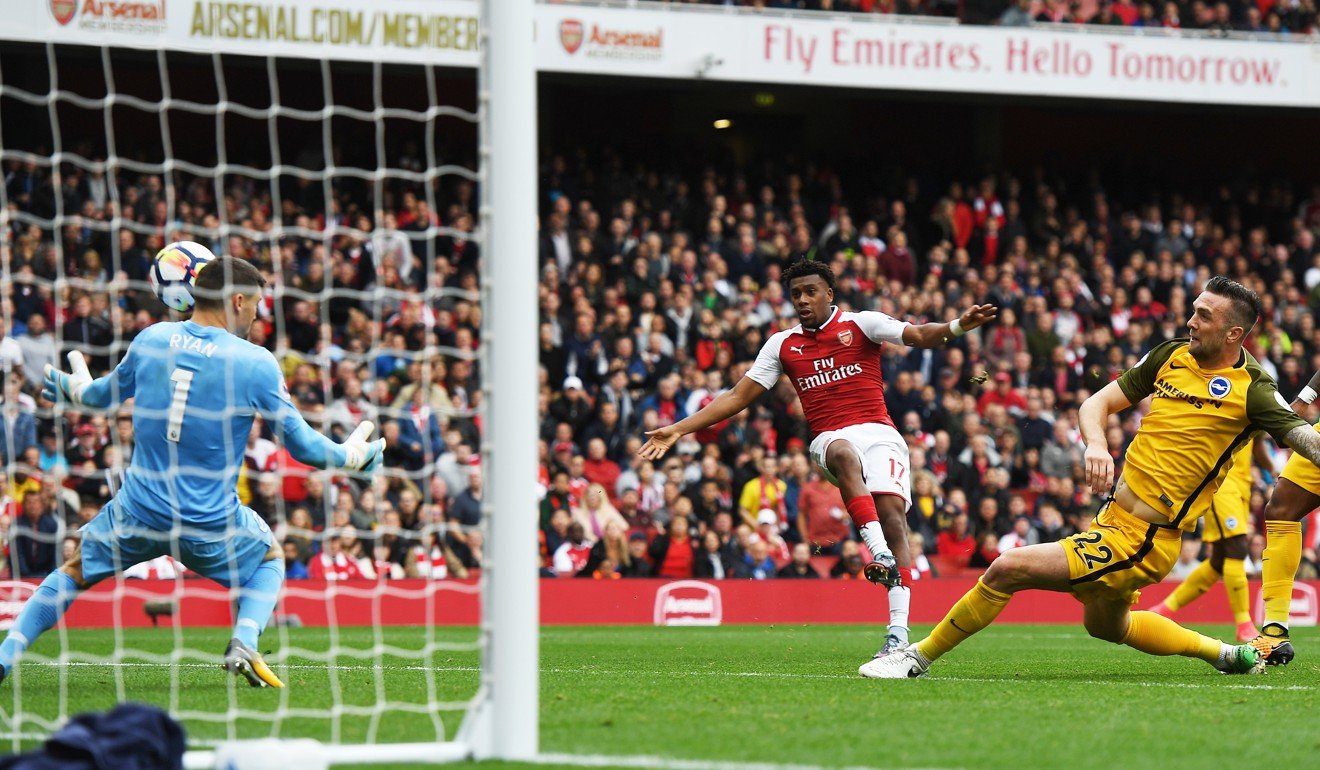 Arsenal's Alex Iwobi (centre) scores his team’s second against Brighton. Photo: EPA