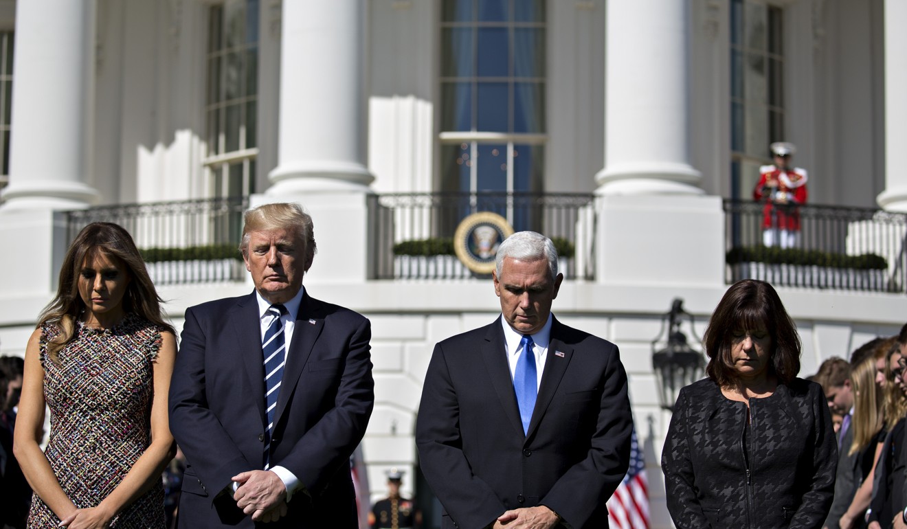 US First Lady Melania Trump, US President Donald Trump, US Vice President Mike Pence, and US Second Lady Karen Pence participate in a moment of silence for victims of a Las Vegas mass shooting on the South Lawn of the White House in Washington. Photo: Bloomberg