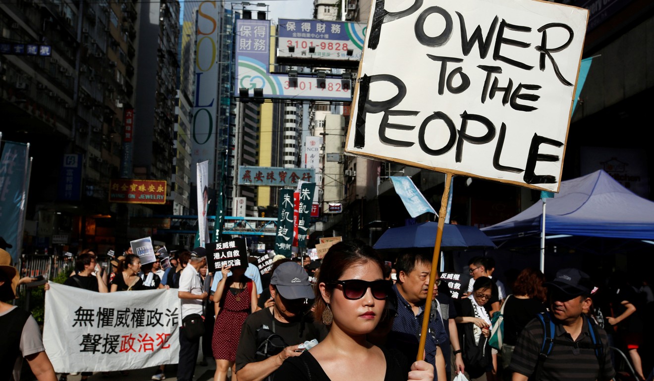 Pro-democracy activists in Hong Kong take part in a protest on October 1, National Day. Photo: Reuters