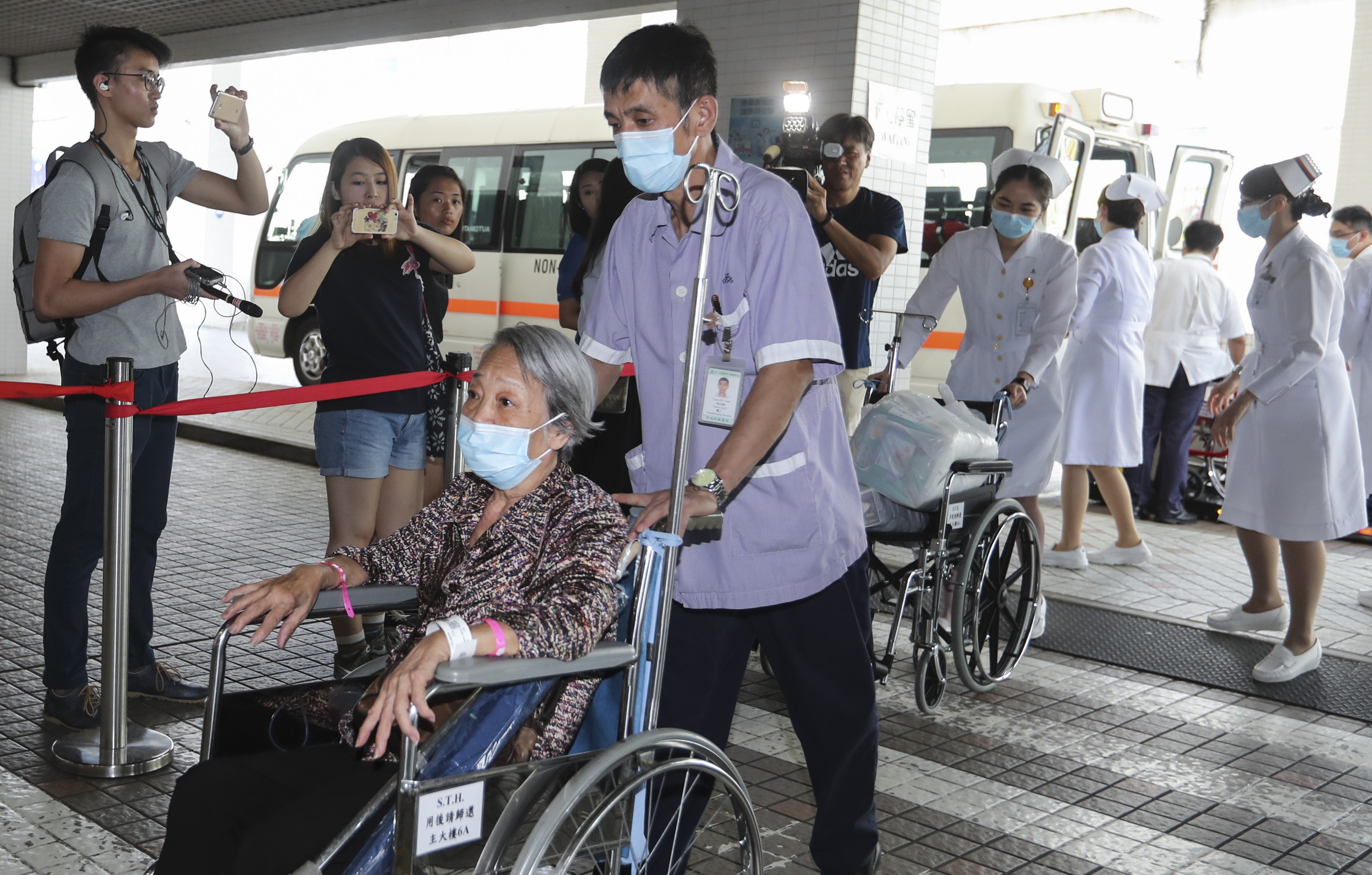Patients from Queen Elizabeth Hospital are transferred to privately run St. Teresa's Hospital in Kowloon City as part of a plan to ease overcrowding in the public health sector in July. Photo: Edward Wong