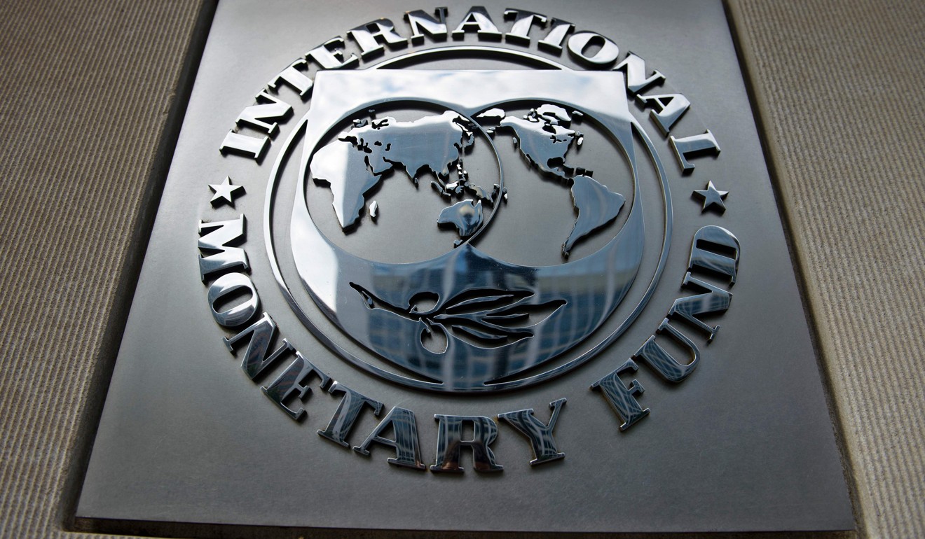 The logo outside the headquarters of the International Monetary Fund in Washington. Photo: AFP