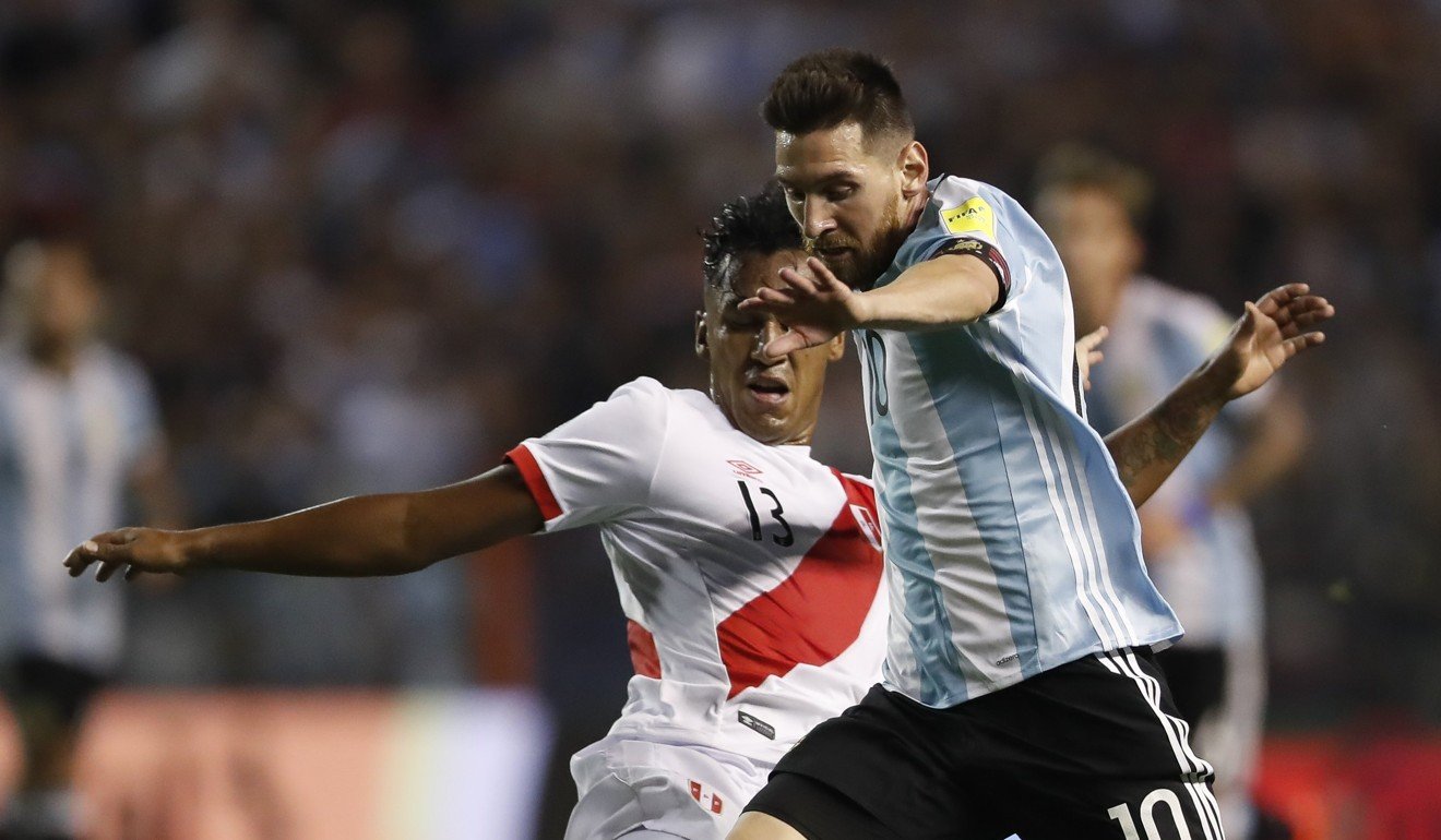 Lionel Messi takes on Renato Tapia of Peru. Photo: EPA
