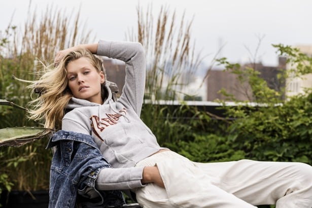 Toni Garrn wears a Vetements jumper she has donated, Isabel Marant trousers donated by Gisele Bündchen, and vintagejacket donated by Kate Moss.