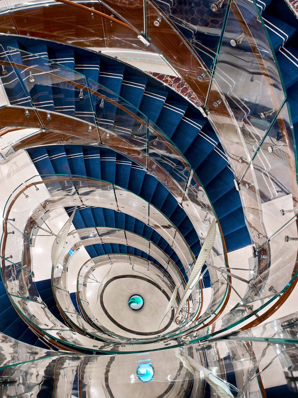 The Seabourne Encore cruise ship's spiral staircase in the atrium.