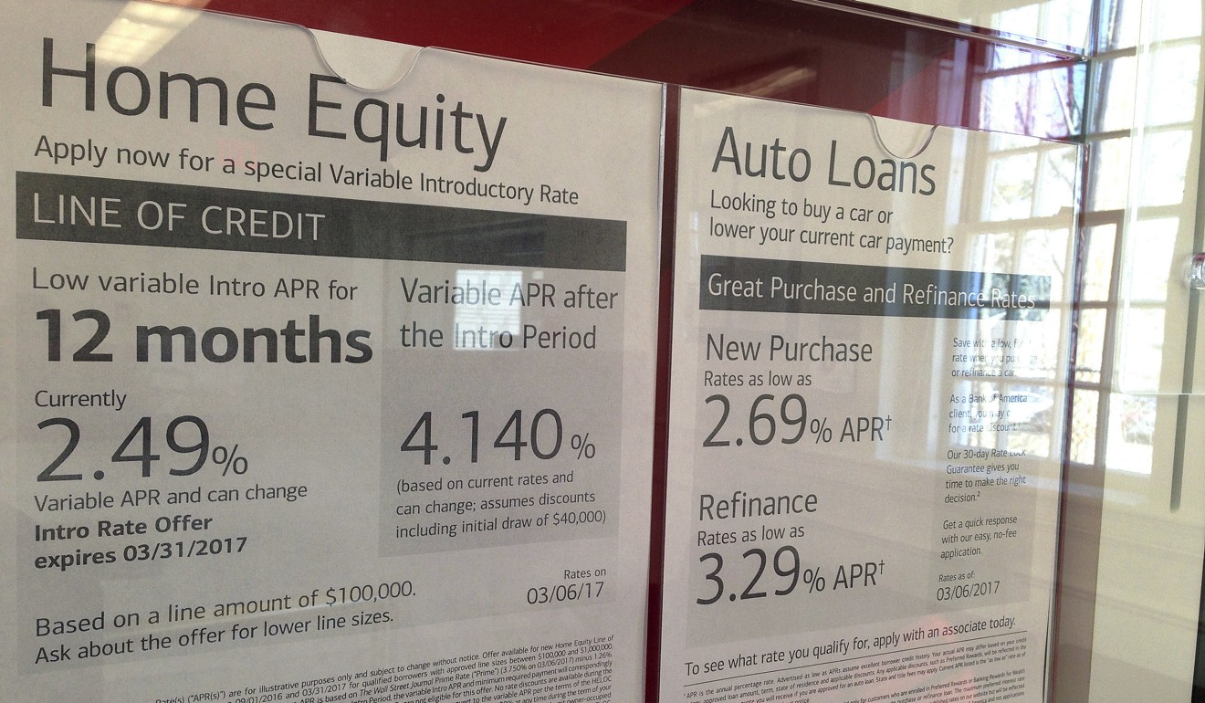 Home equity and auto loan rates are displayed at a bank in North Andover, Massachusetts. Those rates are directly influenced by the Fed’s decision on US interest rates. Photo: AP