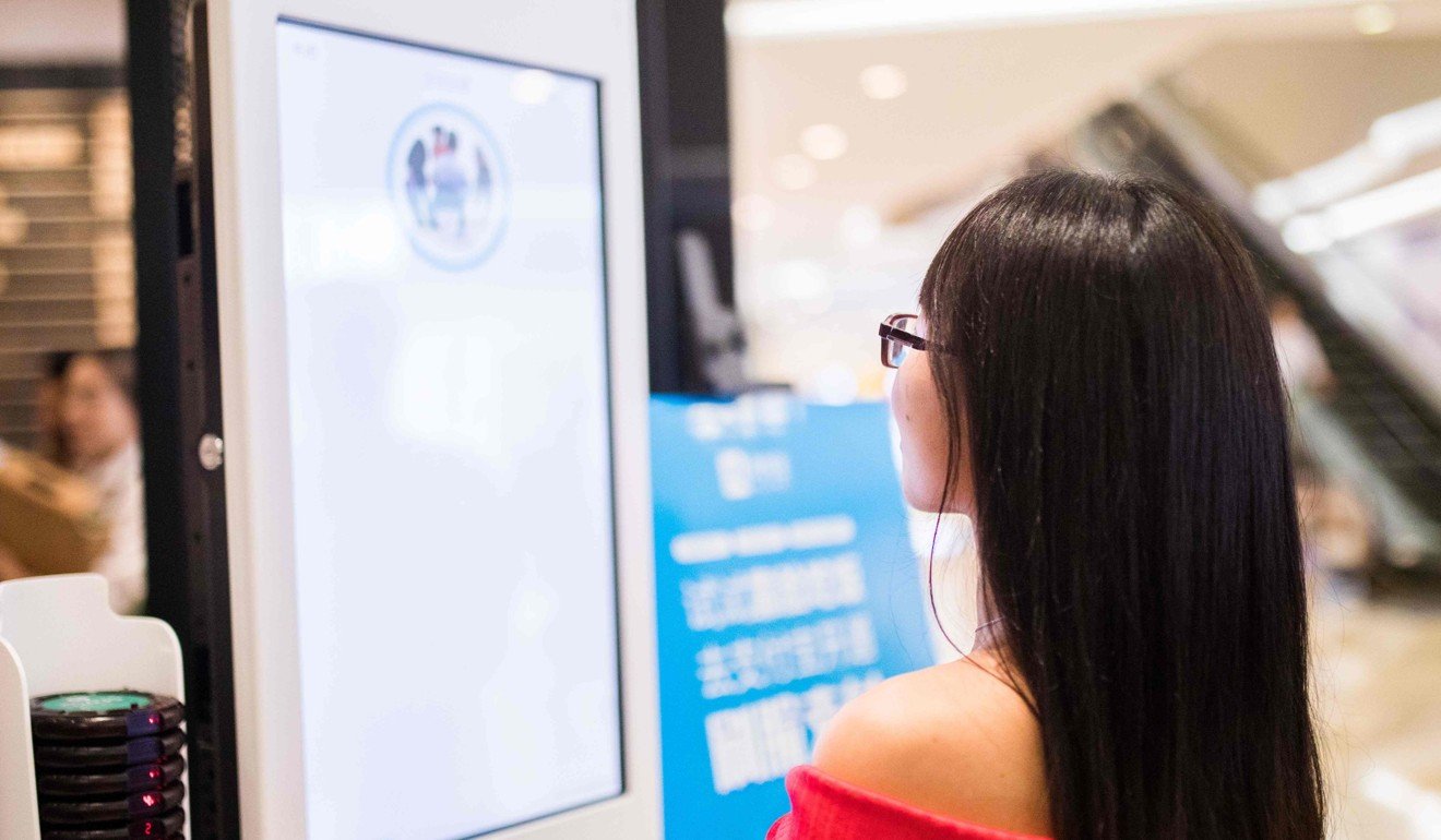 A customer uses the facial recognition system to pay for a meal at a KFC in Hangzhou in eastern China. Photo: AFP