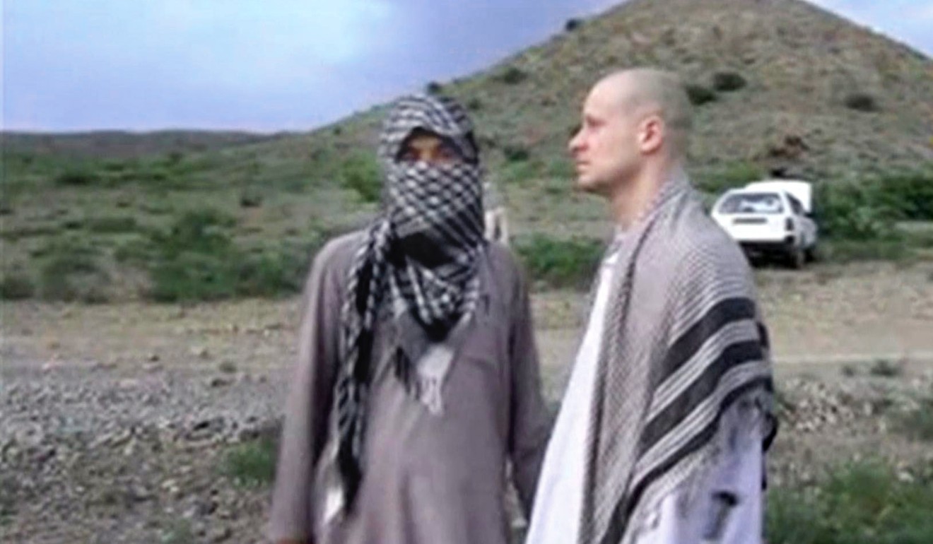 Image from a video released by the Voice Of Jihad Website showing US soldier Bowe Bergdahl (right) with a Taliban fighter in eastern Afghanistan in June, 2014. Photo: AP/Voice Of Jihad Website