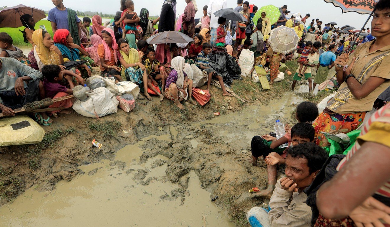 Rohingya refugees who fled from Myanmar wait to be let through after they were forced to walk back by Bangladesh border guards, in Palang Khali, Bangladesh. Photo: Reuters