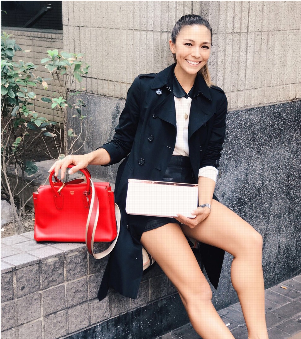 Hong Kong model Cara G shows off her donations to Vestiaire Collective – a red MGM handbag and Ted Baker clutch.