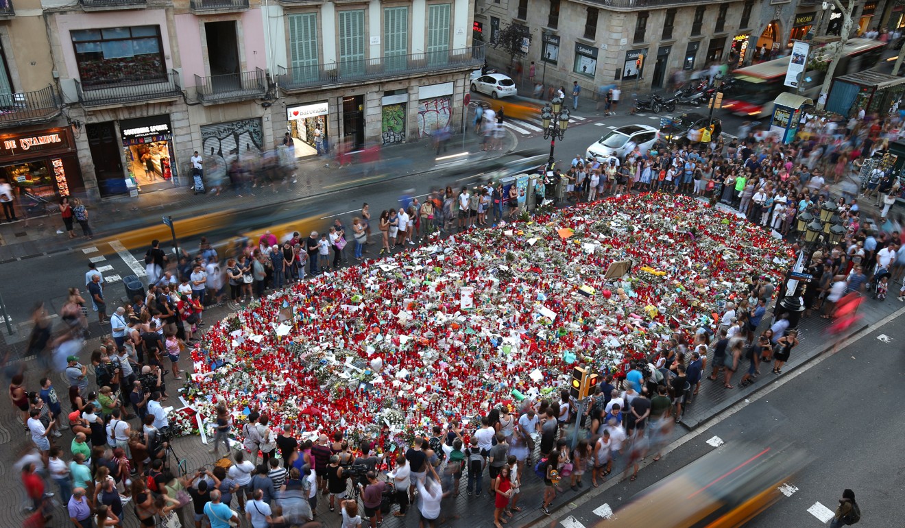 People gather at a memorial where a van crashed into pedestrians in Barcelona. The EU has pledged millions of dollars to try to guard cities against such attacks. Photo: Reuters
