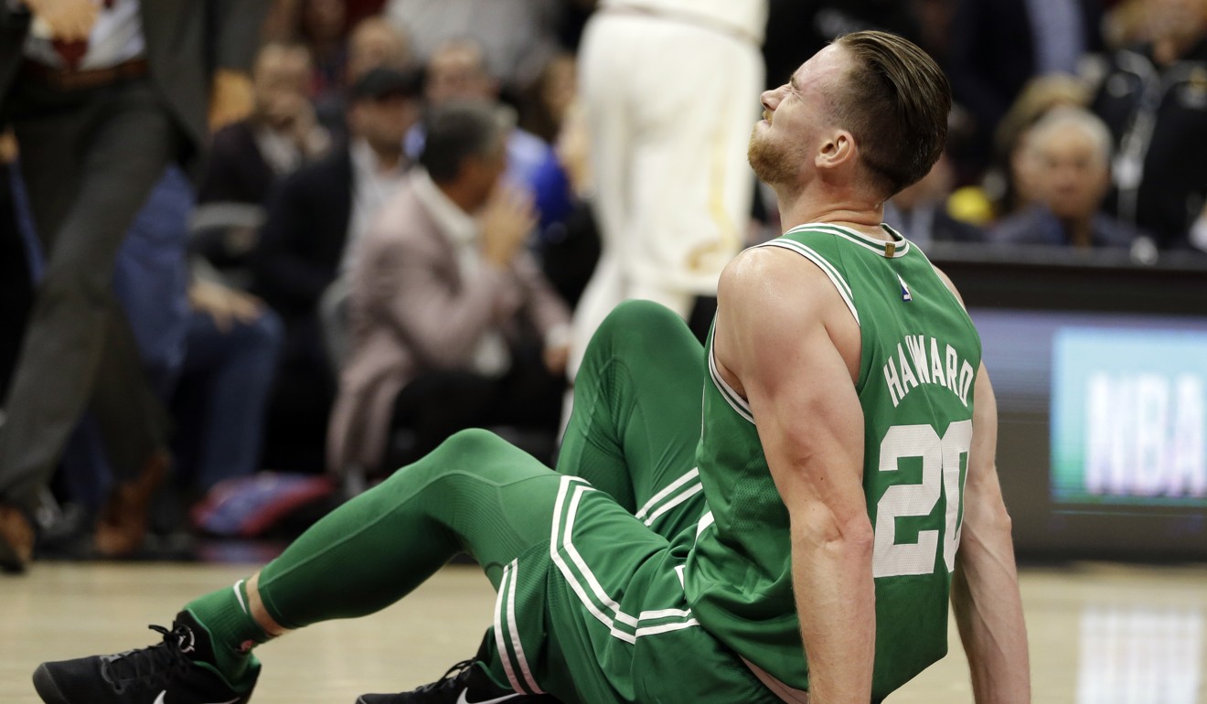 Gordon Hayward grimaces in pain after injuring his leg against the Cleveland Cavaliers. Photo: AP
