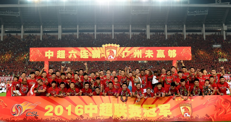 Guangzhou Evergrande players celebrate their sixth straight Chinese Super League title at the end of last season. Photo: Xinhua