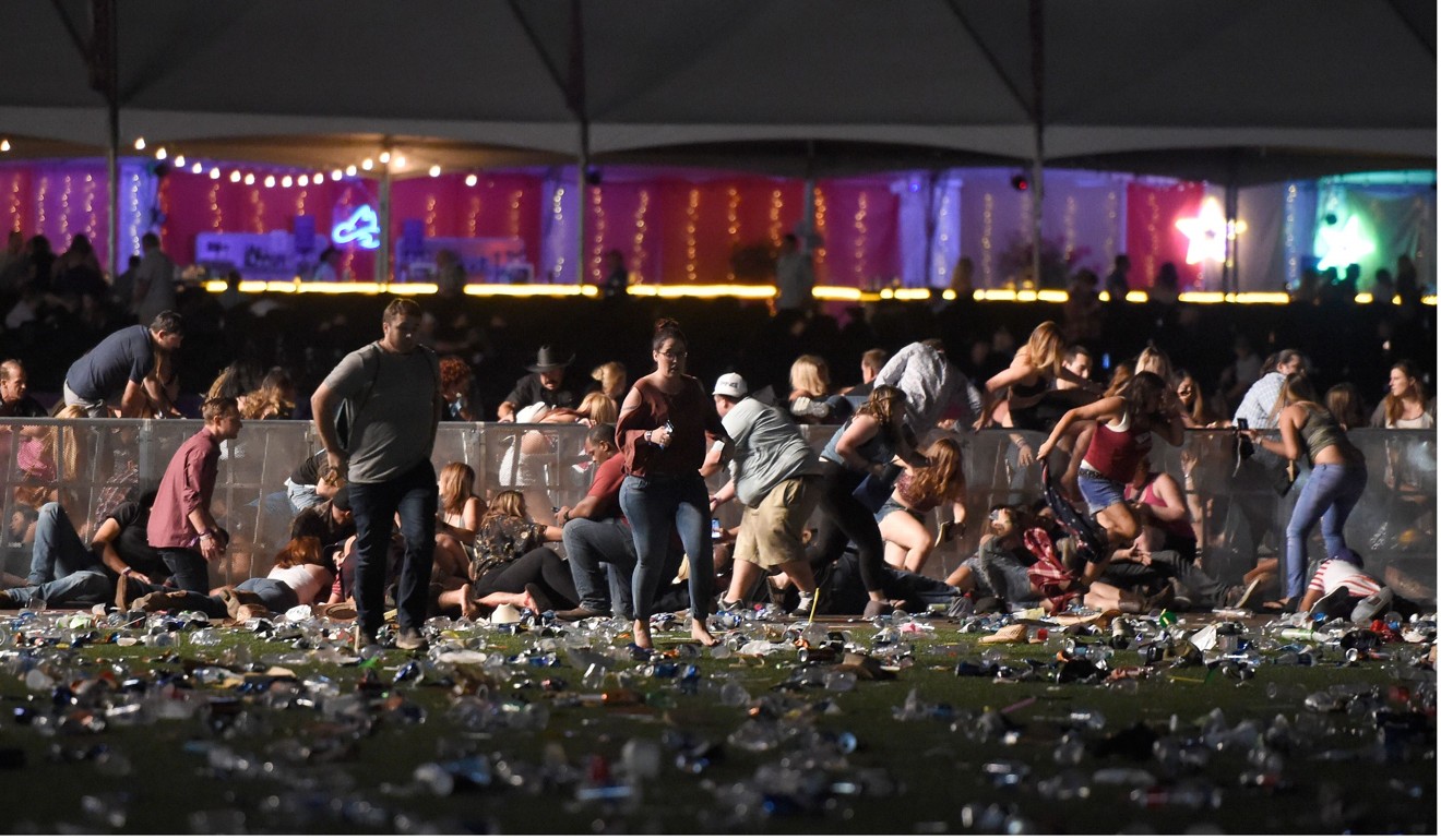 People running from the country music festival after gunfire was heard on October 1, 2017 in Las Vegas, Nevada. Photo: AFP