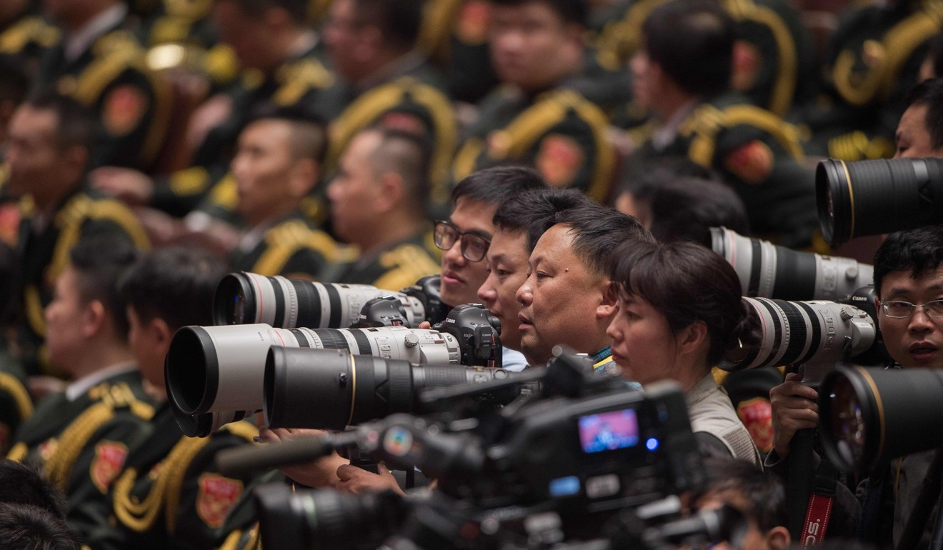 Reporters were allowed to carry only one phone each into the Great Hall of the People on Wednesday. Photo: AFP