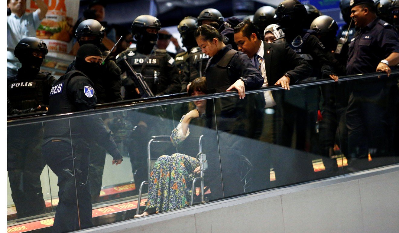 Vietnamese Doan Thi Huong is escorted on a wheelchair as she revisits the Kuala Lumpur International Airport 2. Photo: Reuters