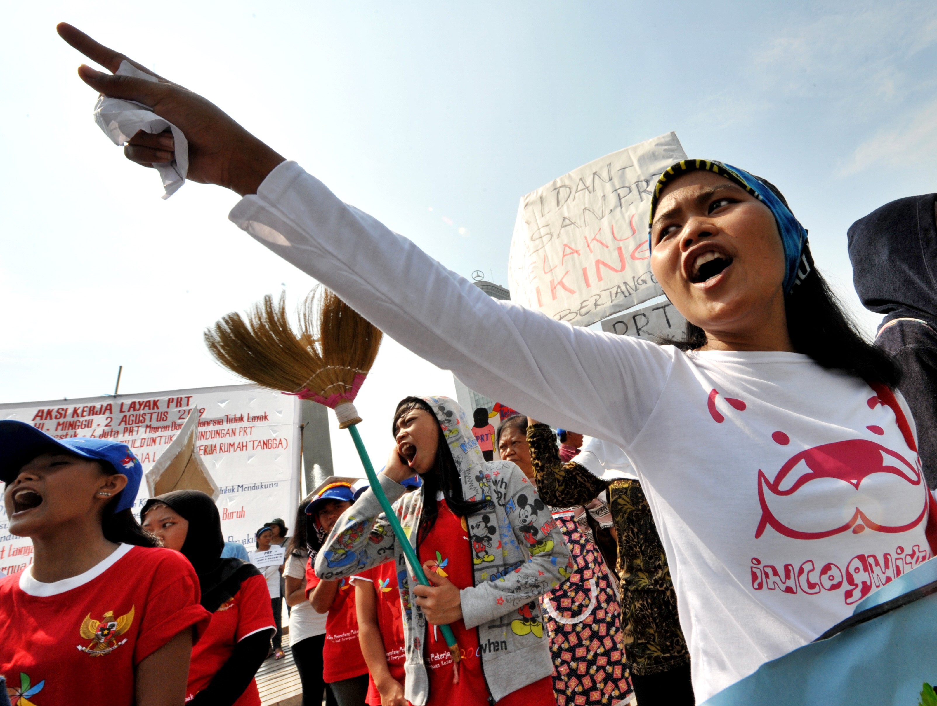 Indonesian women shout slogans during a rally in Jakarta demanding the Indonesian government protect overseas maids and migrant workers from abuse. Photo: AFP