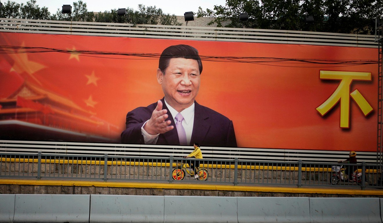 A poster with a portrait of Chinese President Xi Jinping is displayed along a street in Shanghai. Photo: Reuters