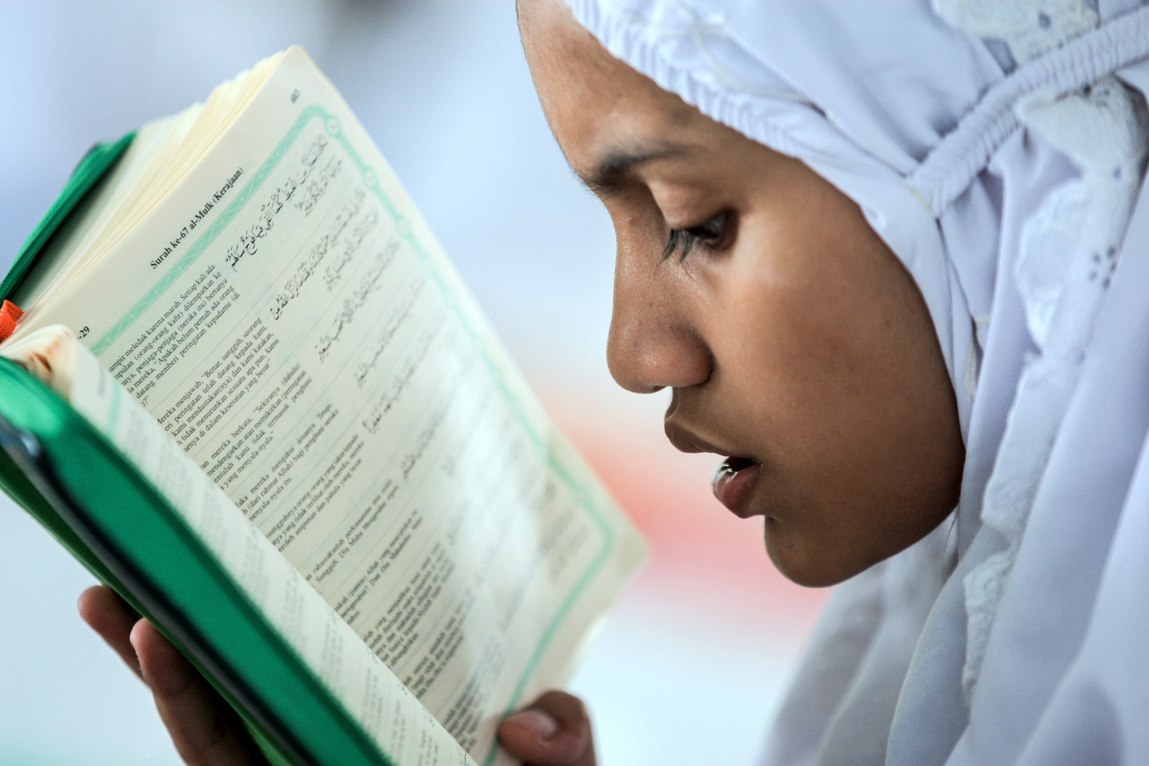 An Indonesian student reads the Koran on the first day of Ramadan in May. Given the challenge of growing extremism in Southeast Asia, it is important to seek solutions that recognise the importance of inclusive religious identities and the institutionalisation of tolerance at all levels of society. Photo: EPA