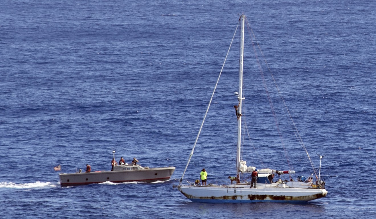 Sailors from the USS Ashland approach a sailing boat with two Honolulu women and their dogs aboard as they are rescued after being lost at sea for several months. Photo: AP