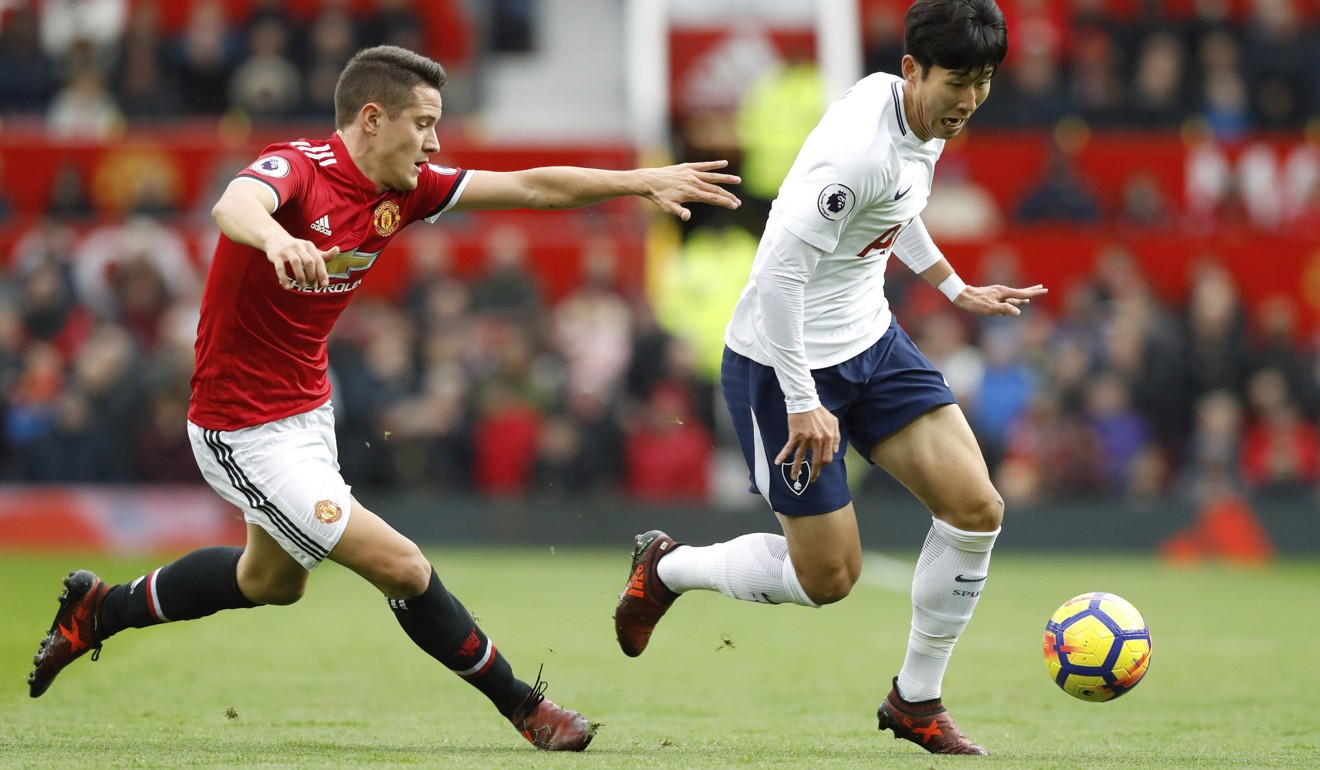 Tottenham’s Son Heung-min tries to get away from United's Ander Herrera. Photo: AP