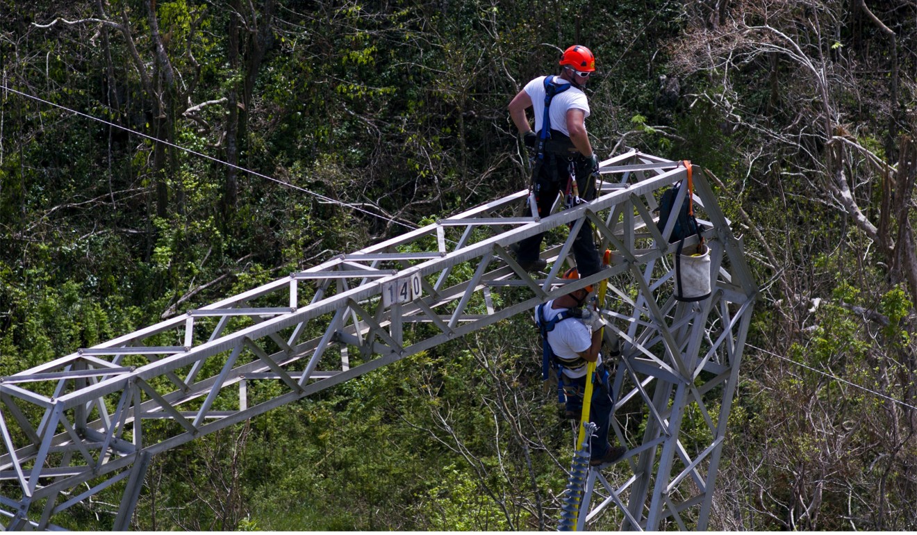 Whitefish Energy Holdings workers restore power lines damaged by Hurricane Maria in Barceloneta, Puerto Rico, on October 15. Photo: AP