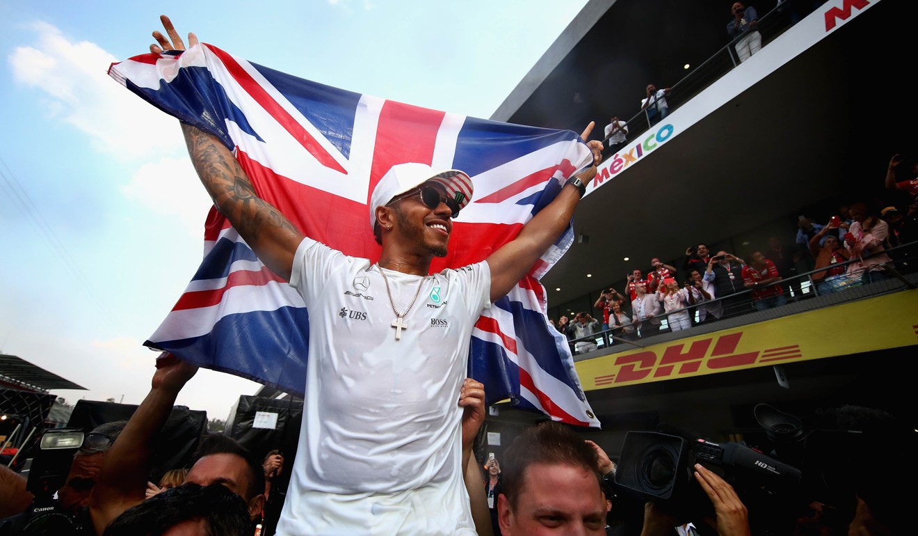 Lewis Hamilton celebrates with the fans. Photo: AFP
