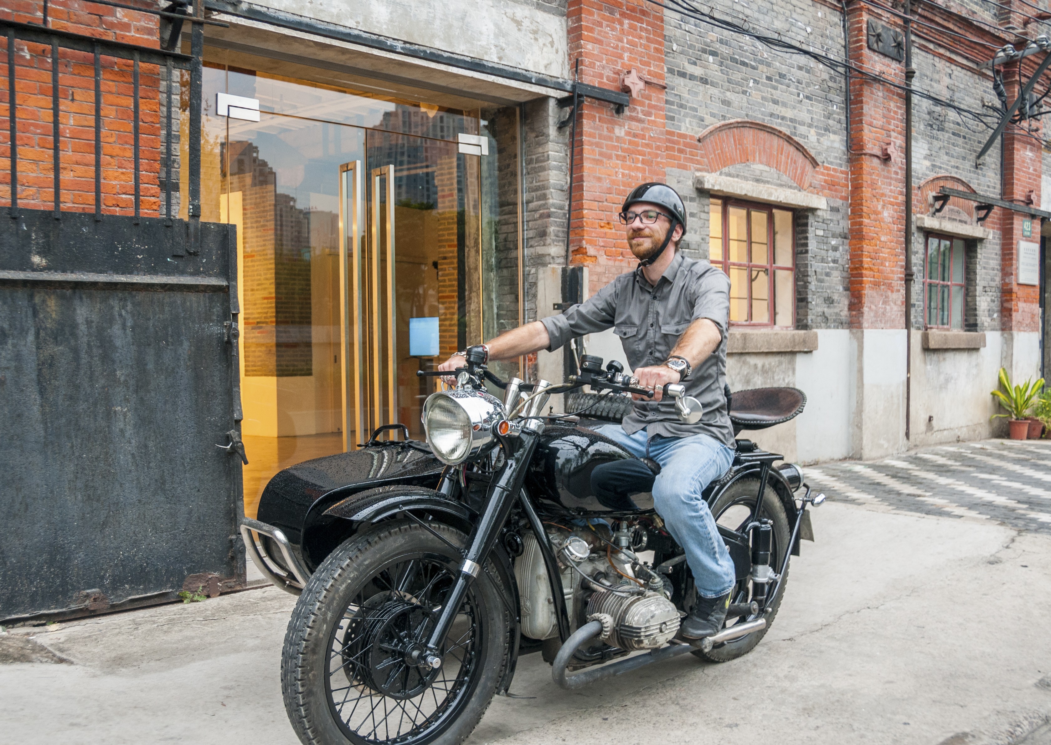 Shanghai Insiders guide Arthur Humeau on his Chang Jiang 750 motorcycle. Photo: Mark Andrews