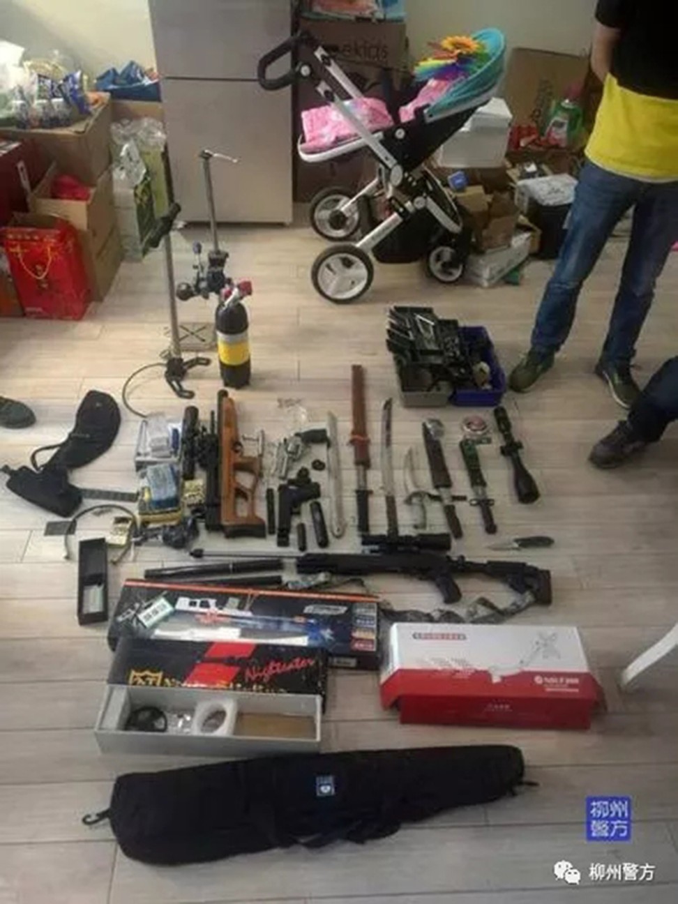 The huge haul included military-grade weapons as well as air rifles and even hand grenade. Photo: Thepaper.cn