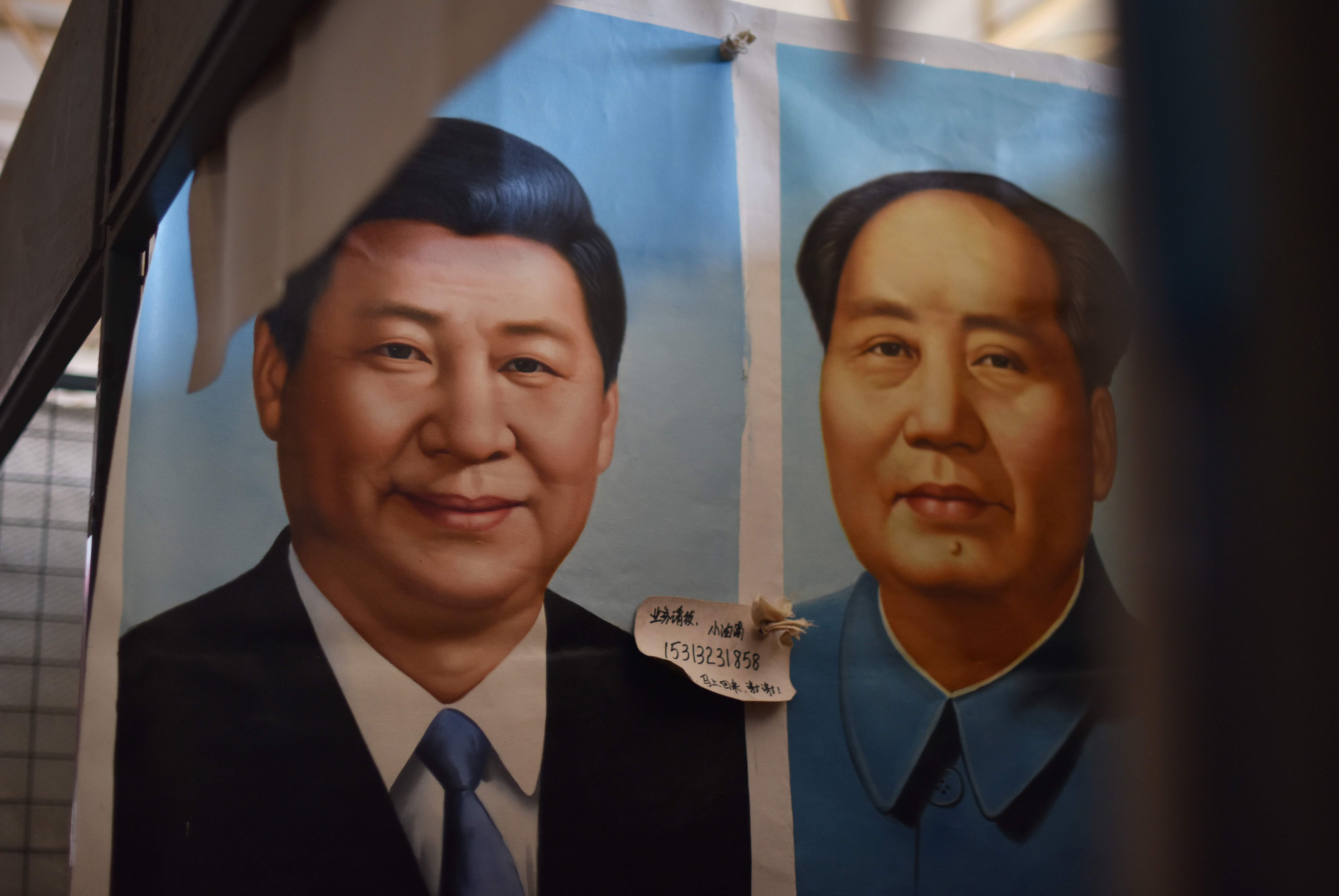 Painted portraits of President Xi Jinping and Mao Zedong for sale at a market in Beijing in September, ahead of the 19th party congress in October. Photo: AFP