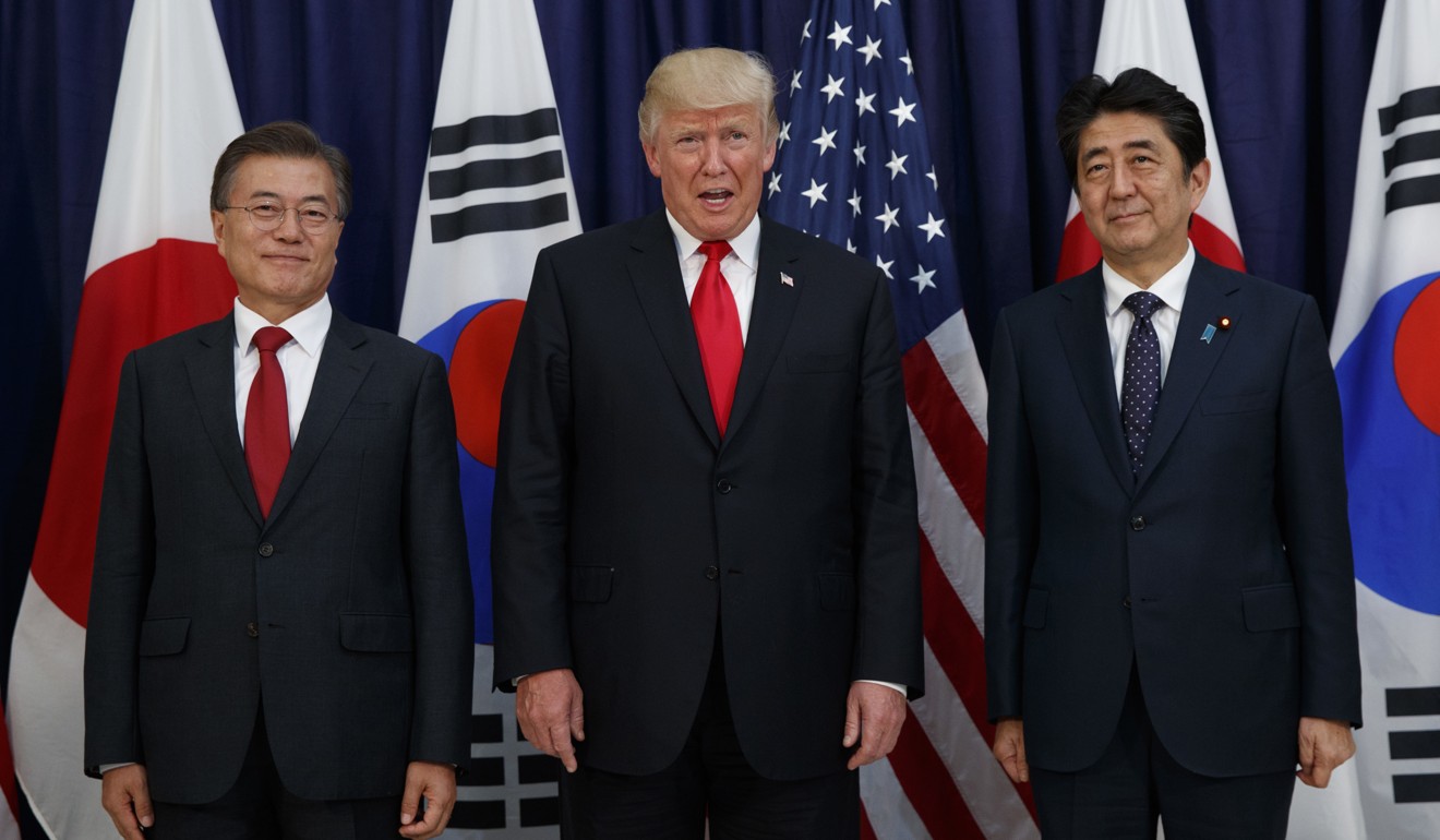 US President Donald Trump met with Japanese Prime Minister Shinzo Abe, right, and South Korean President Moon Jae-in at the Northeast Asia Security dinner at the US Consulate General in Hamburg in July. AP Photo/Evan Vucci, File)