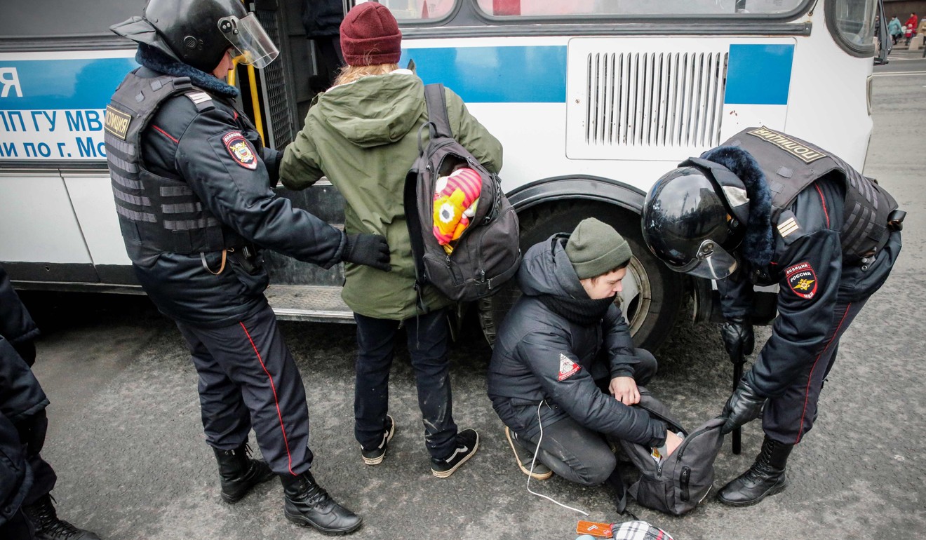 Russian police search opposition activists. Photo: AFP