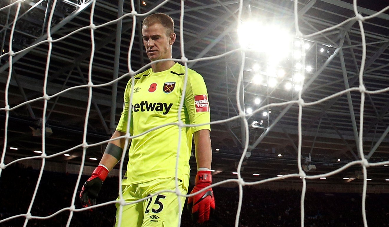 Joe Hart picks the ball out of his net during the chastening defeat by Liverpool, which leaves West Ham 18th in the Premier League. Photo: Reuters