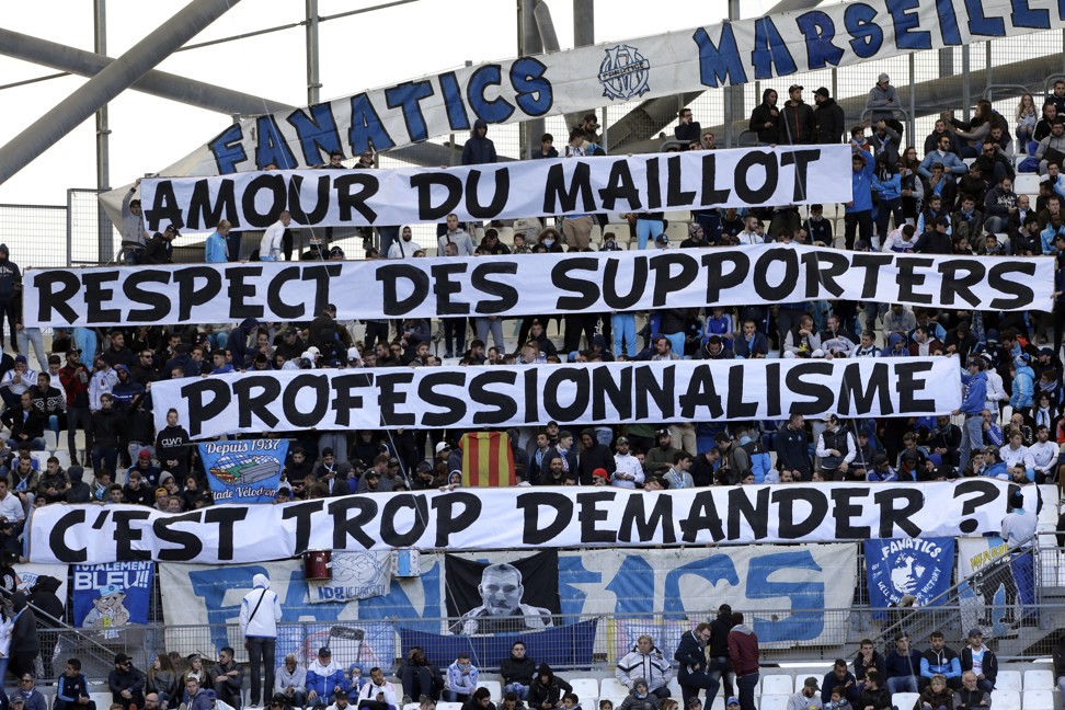 Marseille supporters display banners reading ‘Love of the jersey, respect for supporters, professionalism, is it too much to ask?’, before their Ligue 1 match between against Caen. Photo: AP