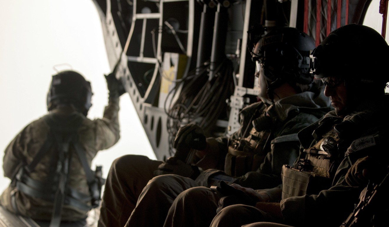 Secret Service Counter Assault Team members travel in a support helicopter. Photo: AP