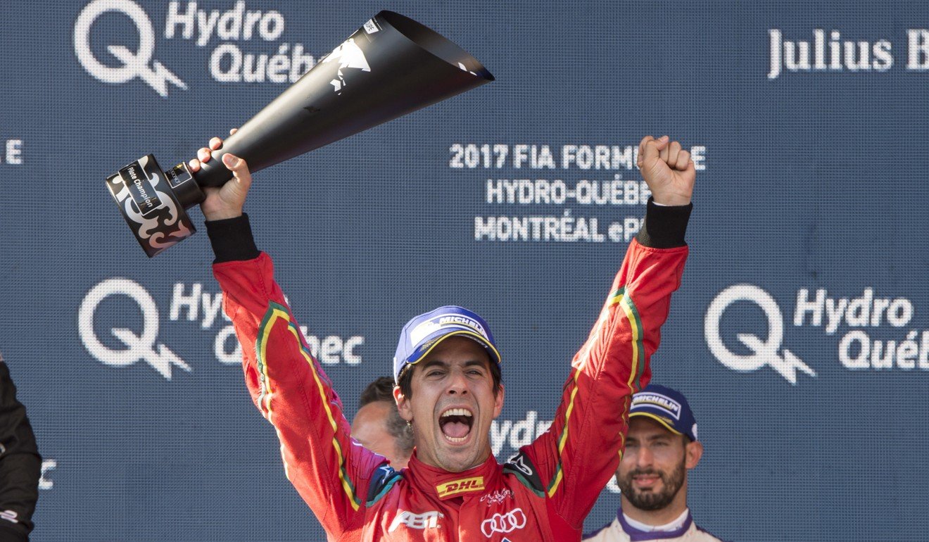 Lucas Di Grassi celebrates after being presented with the driver's championship trophy in Montreal. Photo: AP
