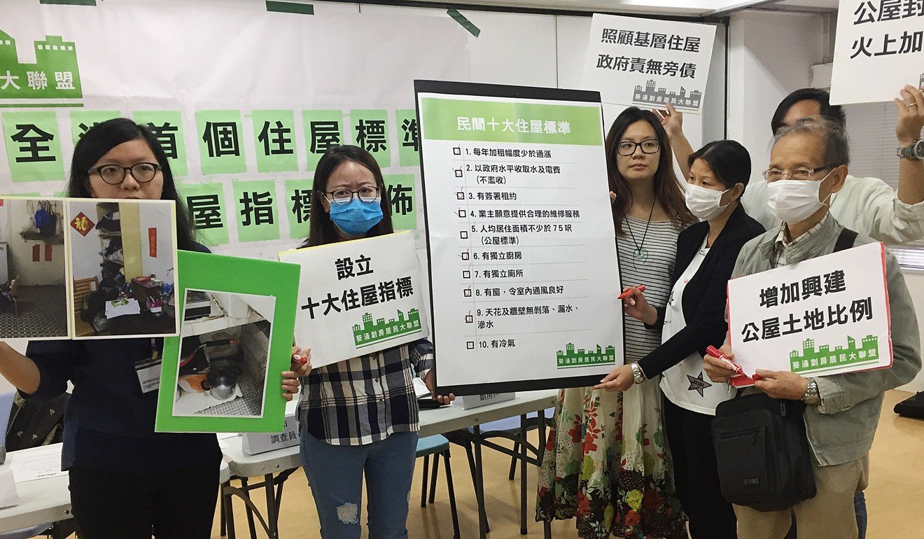 The Kwai Chung Subdivided Flat Residents Alliance urges the government to set a minimum living standard, on October 31. The NGO’s suggestions were based on a checklist of 10 basic living criteria put forward by subdivided flat residents. Photo: Naomi Ng