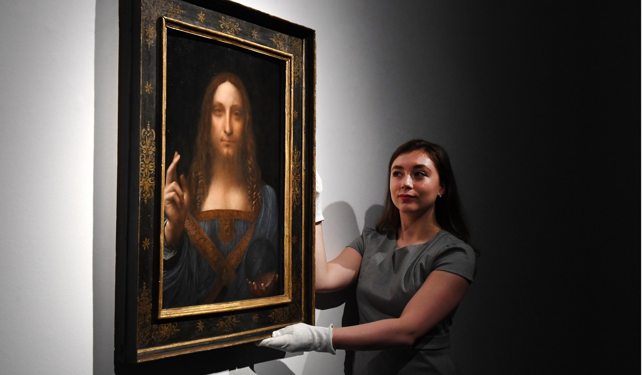 A Christie’s employee with Leonardo da Vinci’s Salvator Mundi in London. Photo: EPA