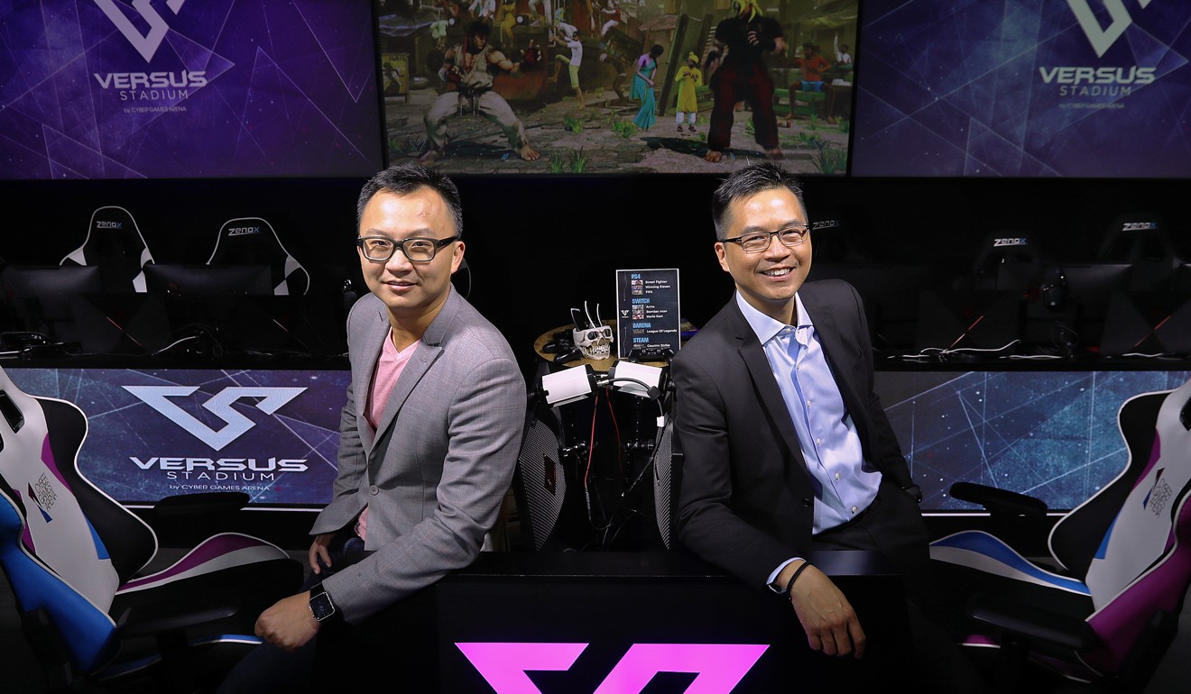 Yeung (left) and Hui (right) set up the e-sports bar in Lai Chi Kok. Photo: Nora Tam